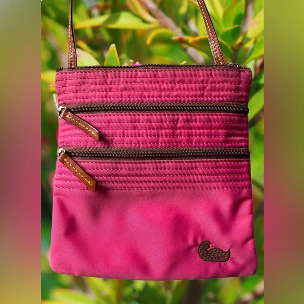 Dooney & Bourke Nylon North South Triple Zip Crossbody in Fuchsia